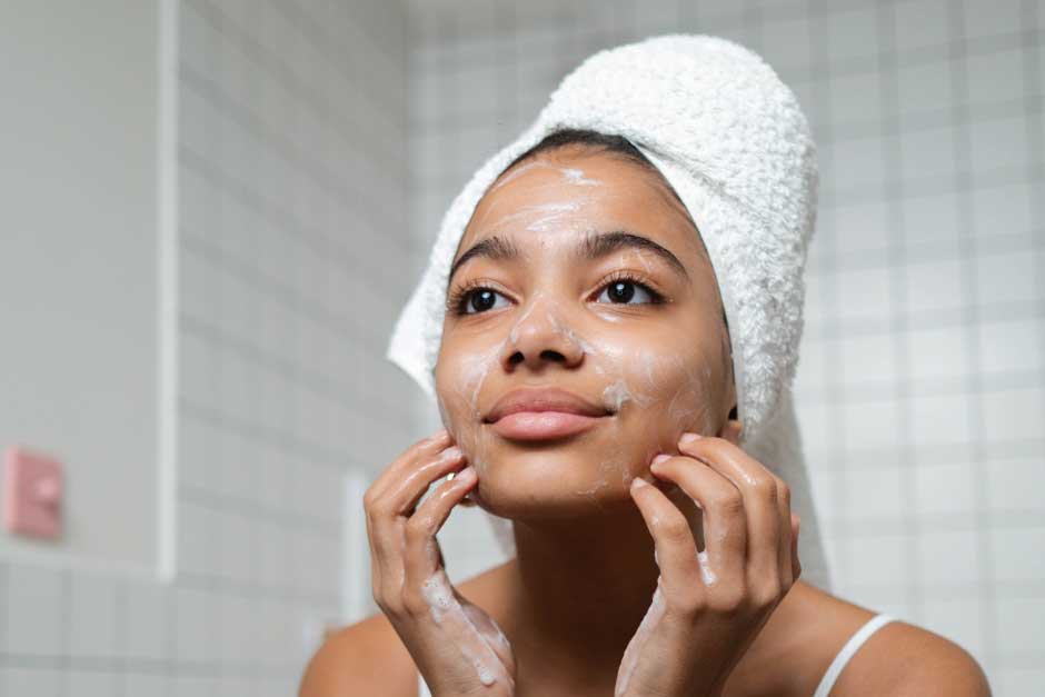 Woman cleaning her face